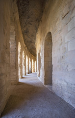 Fototapeta premium arches in hall of old amphitheater in Tunisia