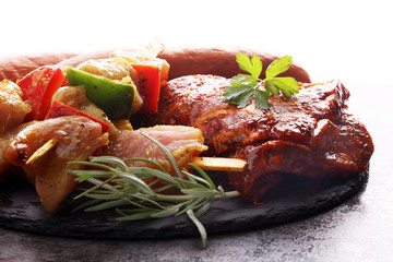 Selection of marinaded meat for bbq grilling with herbs on table