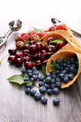 Berries in waffle cones - strawberry, blueberry and black cherry