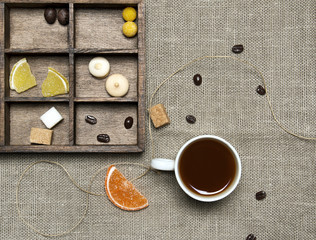Cup of coffee, candies, coffee