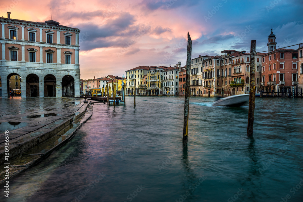 Wall mural panoramic view on famous grand canal among historic houses in venice, italy after rain at sunset