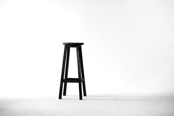 Black empty chair symbolizing a free place for a creative person
