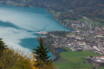 Aerial view to the beautiful blue lake and alpine town