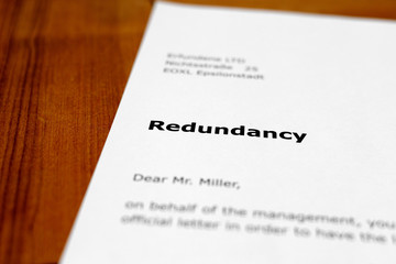A letter on a wooden table - redundancy