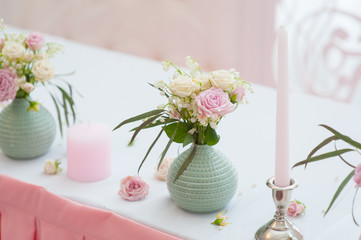 Wedding festive decor. Bouquet from spring flowers. Table of newly married. Restaurant interior.