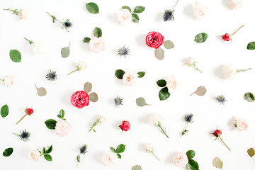 Flower pattern made of red and beige roses, green leaves, branches on white background. Flat lay, top view. Valentine's background. Pattern of flowers. Floral texture.