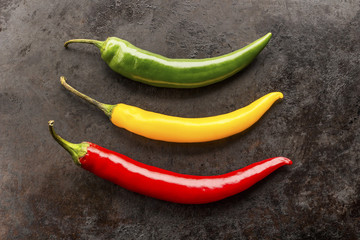cayenne chilli peppers on rusty metal