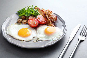 Tasty breakfast with eggs on plate