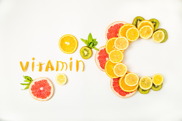 Vitamin C letters made of citrus fruits