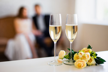 Valentine's day or anniversary concept - glasses of champagne and couple in love