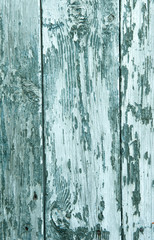 Fototapeta na wymiar abstract wooden background with cracks on the blue paint plaster