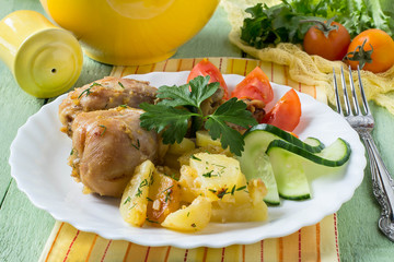 Chicken drumsticks, baked with potatoes