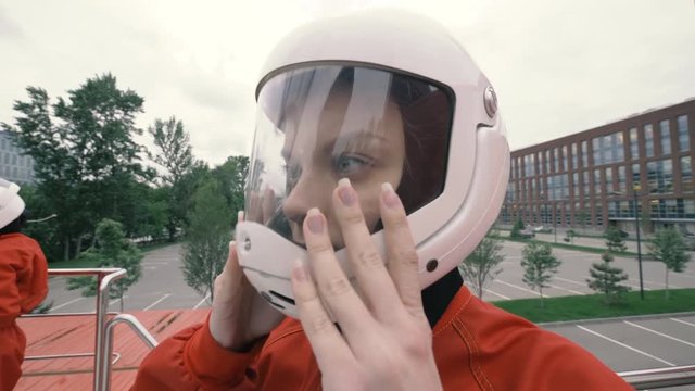 Portrait Girl In Protective Helmet Slow Motion. Young Woman In Protective Helmet