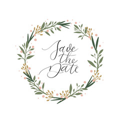 Save the date greeting card with floral wreath. Handwritten. Calligraphy