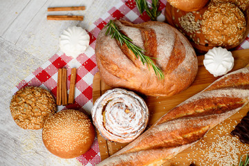freshly baked bread. Different types of bread and rolls on Board