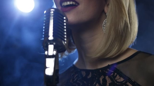 Pretty young woman jazz singer with mic