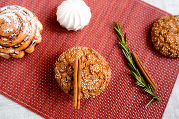Obraz na płótnie Canvas Warm Homemade ginger biscuit cookie topped with sugar and sesame seeds