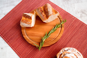 freshly baked bread. Different types of bread and rolls on Board