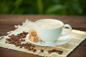 coffee in coffee cup with natural grains