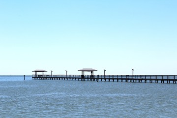 Fototapeta na wymiar Pier and Cabanas Gulf Coast Texas