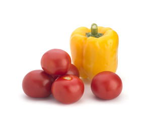 Multi-colored sweet pepper and red tomatoes on a white background