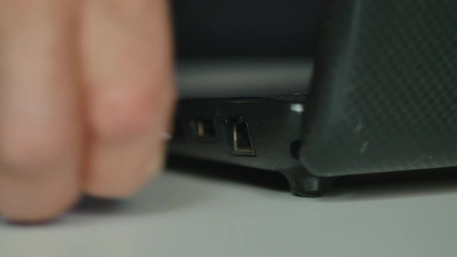 Elderly Man Hand Disconnect Internet Lan Cable To Laptop