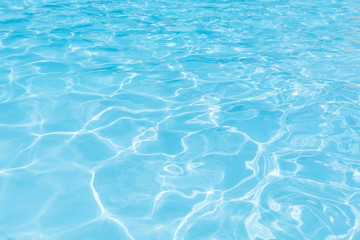 Fototapeta na wymiar Blue water surface in swimming pool for background