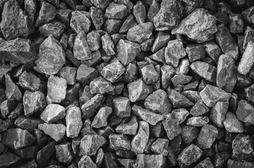 texture of gravel stone on railway track in black and white.