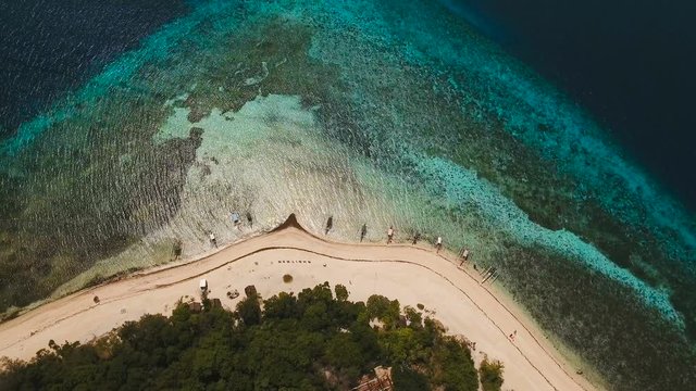 Aerial view of beautiful tropical island Mantigue with white sand beach. Beautiful , sea, resort. Seascape: Ocean and beautiful beach paradise. View of a nice tropical beach from the air. Philippines