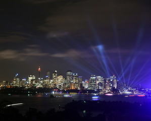 Sydney cityscape at night during Vivid Sydney light festival. Free annual outdoor event of light music and ideas.
