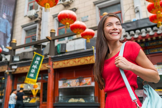 chinatown city lifestyle young Asian woman walking in chinese urban street on china travel. Asia summer travel destination. Girl tourist traveling in Beijing.