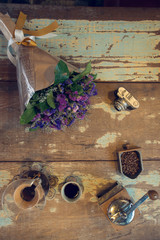 view of ground coffee pouring water on coffee ground with filter, Flower and brick wall background, Colour Retro style. Thailand