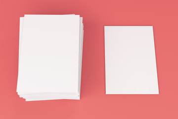 Stack of blank white closed brochure mock-up on red background