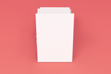 Stack of blank white closed brochure mock-up on red background