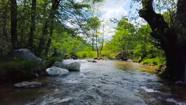 Mountain River Bed with Flowing Water Aerial Drone Footage