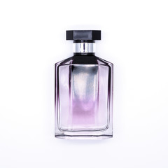 Closeup of a purple bottle perfume isolated on white background.