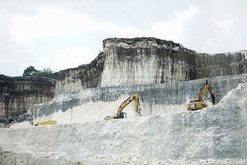 The exploitation of limestone hills forming a unique architectural in Jeddih or Jaddih Hill Madura...