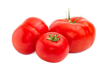 Three ripe red tomatoes closeup