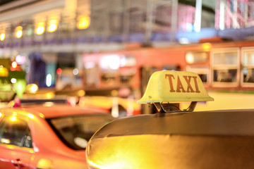 Closeup to taxi sign on the street of Bangkok, Thailand.