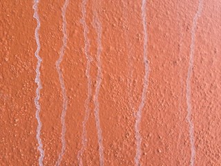 Fototapeta premium Dirty old orange cement wall texture for background