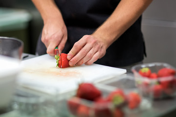 Chef preparing fresh tropical fruit salad