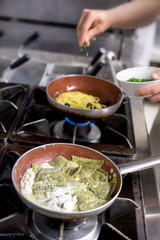 Ravioli in frying pan on burner