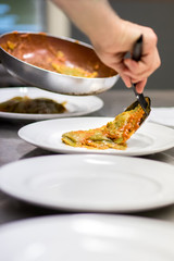 Chef serving up Italian ravioli pasta
