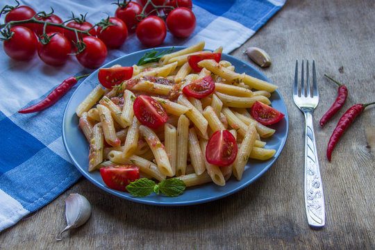 Pasta penne with tomatoes and pepper chilli