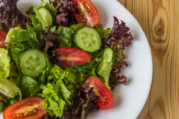 Fresh salad with mixed greens, cherry tomato and cucumber