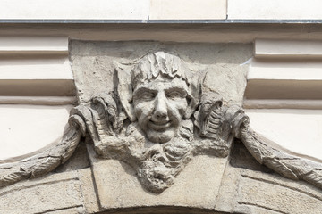Relief on facade of old building, man's face, Prague, Czech Republic, Europe