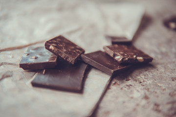 Dark chocolate stack with hazelnuts. Sweet dessert