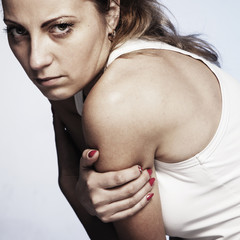 Folded hands of the girl as a symbol of loneliness. (Body language, gestures, body psychology)