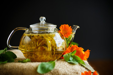 Obraz na płótnie Canvas Therapeutic tea from flowers of calendula