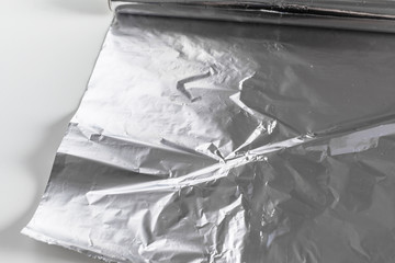 roll of aluminum foil isolated on white background